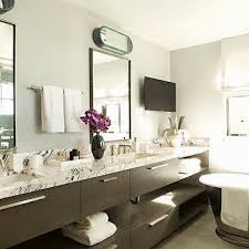 towel bar between vanity mirrors design