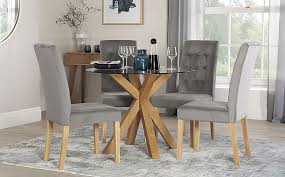 They come in many gorgeous designs and styles. Hatton Round Oak And Glass Dining Table With 4 Regent Grey Velvet Chairs Furniture And Choice