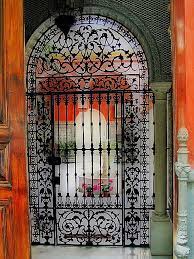 Maybe you would like to learn more about one of these? Photo Entrance To A House In Sevilla Spain Example Of Ironwork Looking In To The Patio Wrought Iron Gates Iron Doors Beautiful Doors