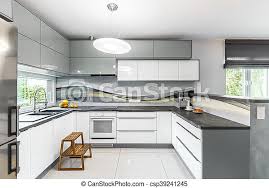 Manufacturer of high gloss kitchen cabinets offered by aaica modular kitchen (unit of r & r industries), delhi. High Gloss Kitchen Idea Light And Spacious Kitchen With White Furniture High Gloss Tiling And Window Canstock