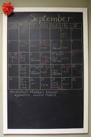 Family With A Chalkboard Wall Calendar