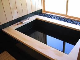 granite soaking tub with wood frame