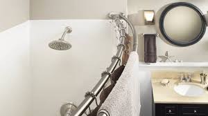bathroom with a curved shower rod