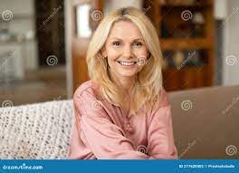 Portrait of Blonde European Mature Woman Posing Smiling at Home Stock Photo  - Image of relax, white: 277620402
