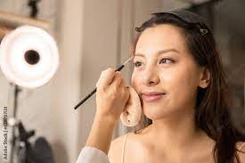 young asian woman in bedroom make up