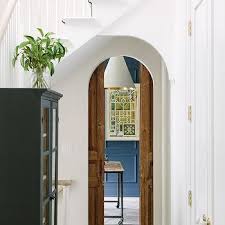 Stained Wood Arched Dual Pocket Doors