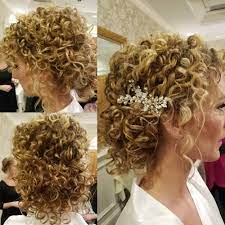 Pin some curls near the base of the ponytail to hide the elastic. 29 Easy Cute Updos For Curly In Trending In 2021
