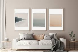 Three Framed Art Pieces Hang On A Wall