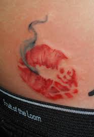 smoke pirate lip tattoo on lower back