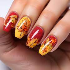 nails with autumn leaves and a maple leaf