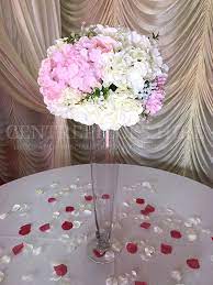 flower ball in tall glass vase