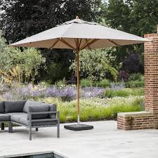 Best parasol for sunny days. Parasol In Khaki Or Natural With Granite Base Garden Trading