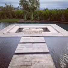 How to make a fire pit float · 1. Modern Group A Sunken Fire Pit Surrounded By An Infinity Edge Pool And Floating Steps Talk About Tranquility In The Desert Outstanding Stonework Done By Our Crew Using Stone From