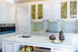 how to style glass kitchen cabinet