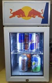 A fridge of red bull energy drinks with a blue orb on top of it. Red Bull Mini Fridge For Cold Drinks For Pub Home Garden Garage 220v 240v Ebay