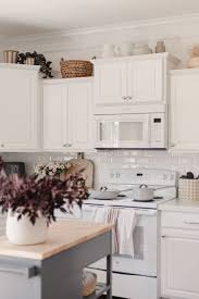 how to decorate above kitchen cabinets