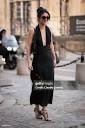 Cassandra Cano wears a decorated black maxi dress, Yves Saint ...