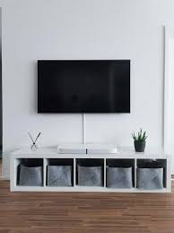 what to put under the tv on the wall