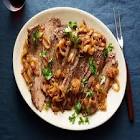 beef brisket with cherry merlot sauce and caramelized onions