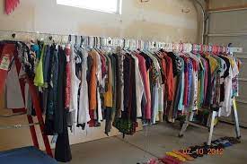 I got tired of stringing rope on my garage to hang up. Hanging Clothes At Garage Sale Great Ideas How To Hang Clothes For Garage Sale Ladders Nee Yard Sale Clothes Rack Yard Sale Clothes Garage Sale Clothes