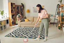 carpet with her daughter cleaning sofa