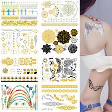 These tattoos were at the peak 10 to 15 years ago, but there are slowly coming back to trend. Fashion Temporary Tattoos 8 Sheets Removable Waterproof Instant Temporary Fake Jewelry Tattoos Body Art Sticker Wrist Arm Bands Metallic Gold Silver Color Shimmer By Tattoo Art Amazon In Home Kitchen