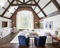 white sectional with blue accent chairs