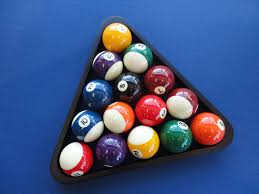 Fill in the space between the rack corners with the other solid and striped balls. How To Rack Pool Balls To Organize Billiard Balls At The Beginning Of A Game How To Rack Pool Balls Billiards Setup Billar Billiards Pool Table Pool Games