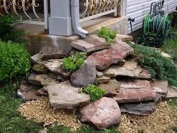 Rock garden designs with green grass and vegetable beds : 11 Attractive Landscape Drainage Solutions Fra Dor Tips