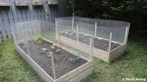 It is flimsy and easily just keep in mind that your on center framing of the enclosure would be best to match up with the. How To Build A Diy Raised Garden Bed And Protect It With A Metal Fence