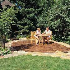 The hardest parts of the process are the labor of mixing the wet stone dust that serves as the pavers' base and then lifting and moving the stones. How To Build A Stone And Brick Patio Diy The Family Handyman
