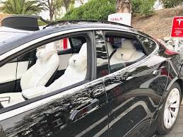 Black model 3 with white interior. Tesla Made More Comfortable With New Custom Headrest Electrek