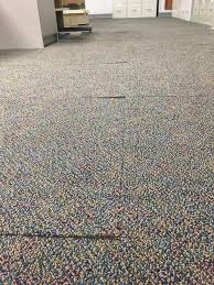 cimex causing carpet tiles to lift up