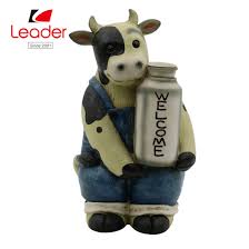 Two milk bottles in an old fashioned metal carrier. China Hand Painted Polyresin Cow Statue With Welcome Sign For Home Decor China Cow Figurine And Resin Cow Price