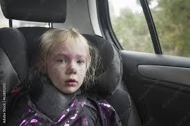 Girl In A Car Seat In Costume