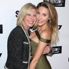 Because september 26 is olivia newton john's 65th birthday, we take a look back at the evolution of the cultural icon in 8 photos. Olivia Newton John S Daughter Chloe Lattanzi Gives Emotional Update On Mom S Cancer