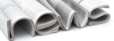 newspapers folded to spell "news"