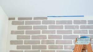 Stenciling A Faux Brick Wall In A Den