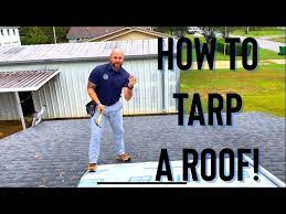 how to tarp your roof in the rain step
