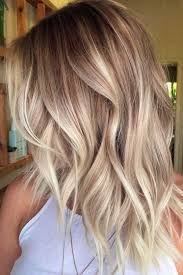 Play up your color even more with the help of a another example of how ~elevated~ contrasting roots can look, this blonde balayage is a pretty mix of honey, brown, and black tones. Blonde Hair Hair Color With Brown And Blonde