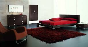 Bedroom set with a bed and chests made of wood in red oak finish. Minimal Red Bedroom Design My Decorative