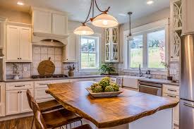 Kitchen contemporary style beech with accent wood light color euro flair door reeded glass appliance garage upper & lower diagonal corner cabinets slab drawers concrete countertop toe kick vent standard overlay brushed nickel hardware. Kitchens3 Great Northern Cabinetry