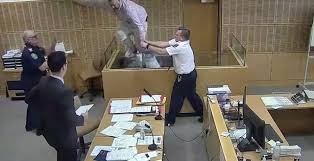 dock and tries to escape courtroom