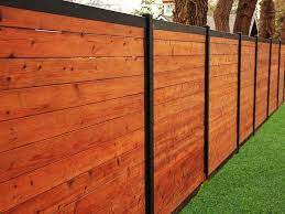 See more ideas about metal fence posts, metal fence, wood fence design. Build A Wood Fence With Metal Posts That S Actually Beautiful