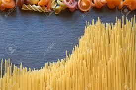 Thin Spaghetti And Other Pasta On A Black Slate Stone Look Like