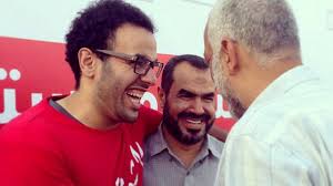 Mohamed Soltan, left, with his father and friend, has been at the heart of the protests in Cairo. Courtesy Mohamed Soltan - ht_mohamed_soltan_jef_130816_16x9_608