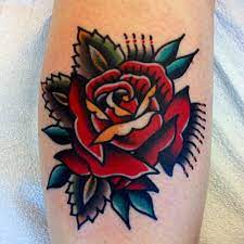 A traditional rose tattoo works excellent as a sleeve tattoo because you can connect several flowers. Pin By Gaby Alexander On Tatspiration Traditional Rose Tattoos Tattoos Cool Tattoos