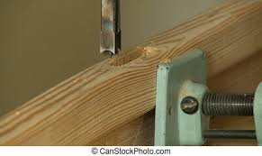 You can achieve this by using a chisel, a drill and saw, or a router. Cutting Square Hole In Wood Steady Medium Close Up Shot Of A Square Hole Being Cut Into A Piece Of Wood Canstock