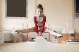 child gymnastics balance beam girl