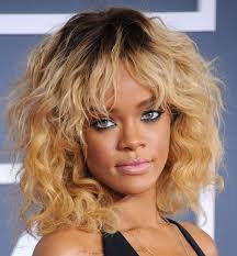 Do blondes have more fun? Rihanna Blonde Hairstyle With Full Small Curls And Wavy Long Bangs